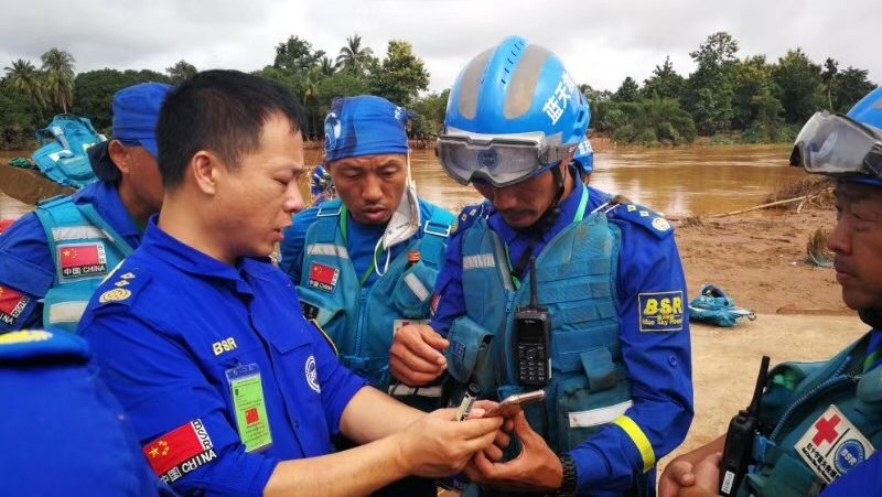 Rescue Forces Analysing Situation In Flooded Area